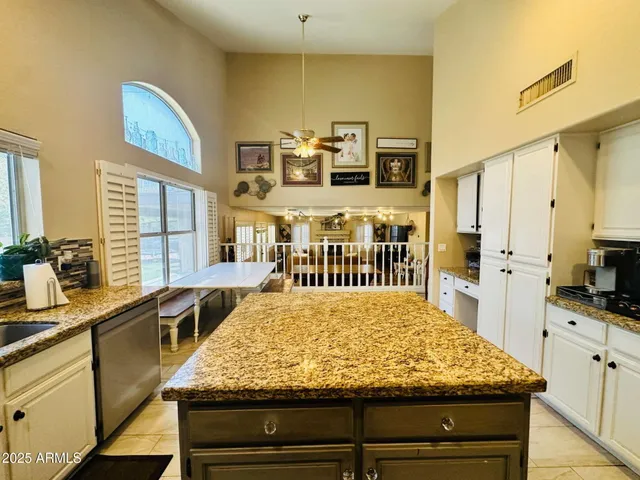 a view of a kitchen counter top and living room