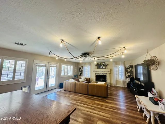 a living room with furniture fireplace and flat screen tv