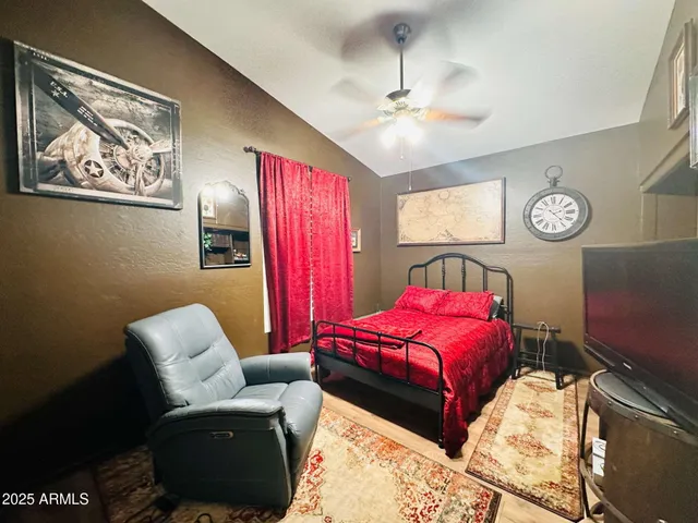 a bedroom with furniture and a bed