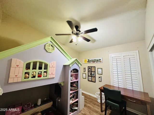 a view of a work space with furniture and a window