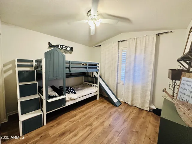 a view of a livingroom with furniture and staircase