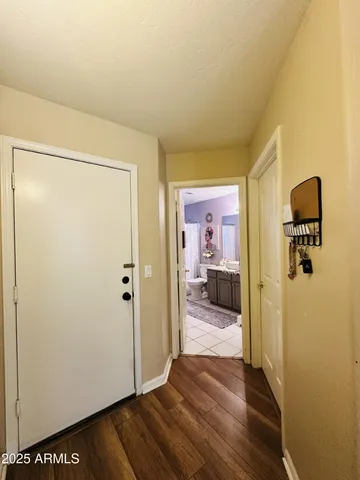 a view of a room with wooden floor