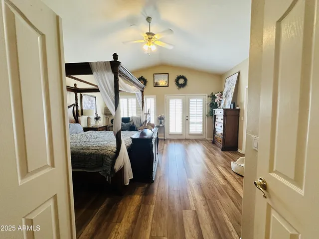 a view of living room filled with furniture and wooden floor