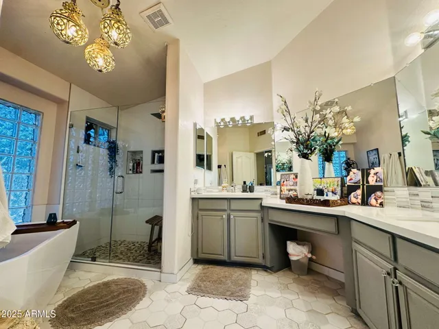 a spacious bathroom with a sink a toilet and shower