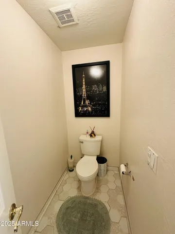 a bathroom with a toilet and a sink