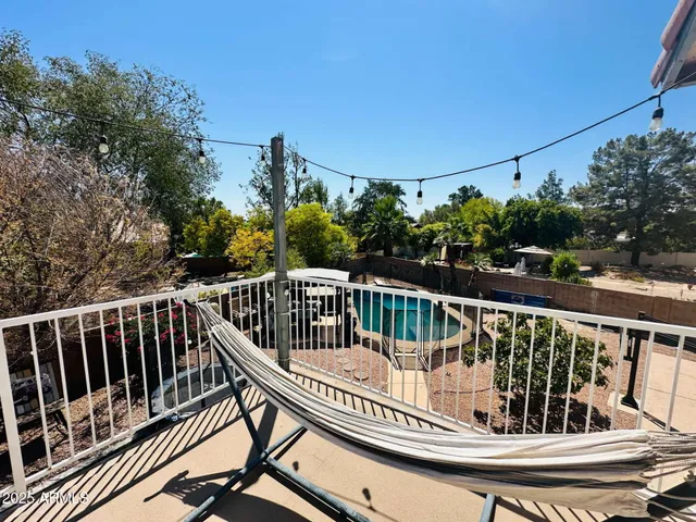 a view of balcony with furniture