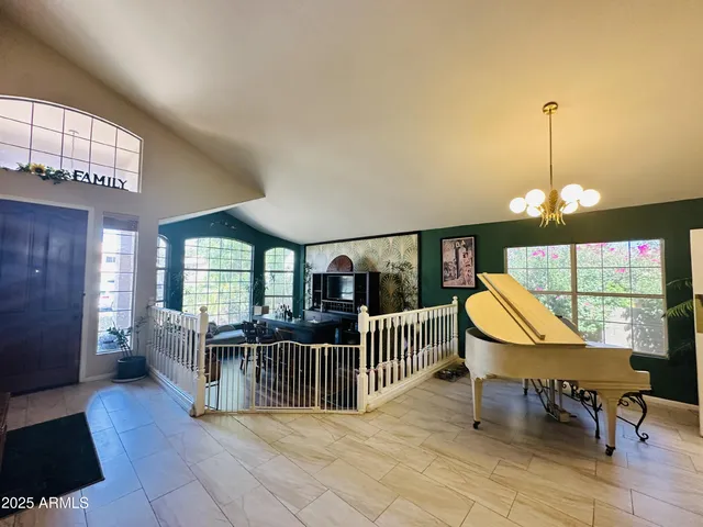 a view of a dining room with furniture wooden floor and chandelier
