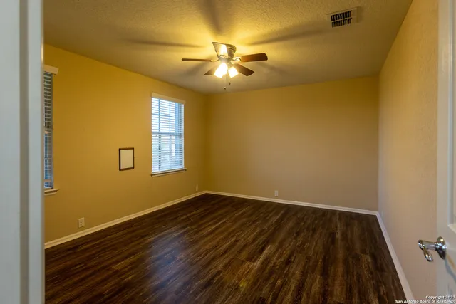 a view of front door with wooden floor
