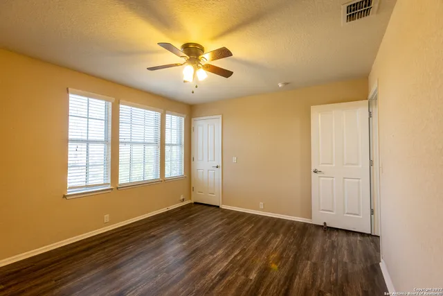 a bathroom with a double vanity sink toilet mirror and shower