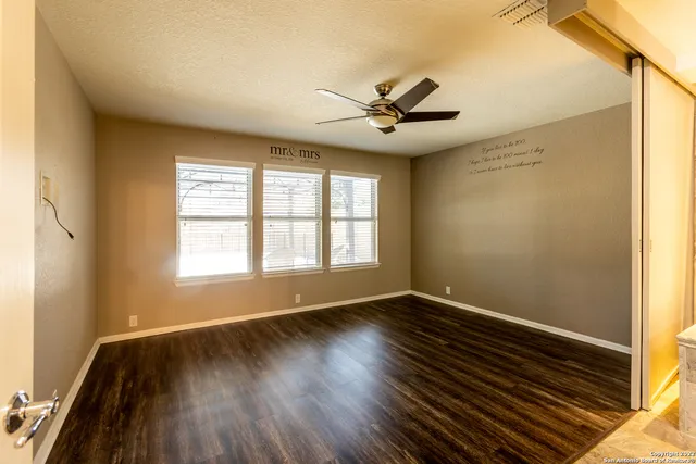 a bathroom with a tub sink and shower