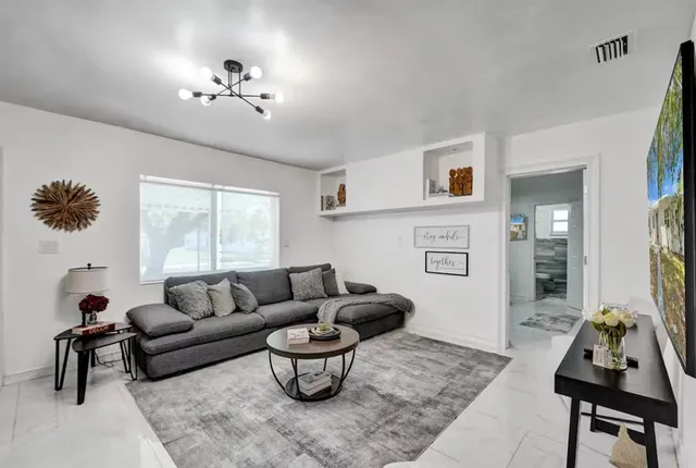 a living room with furniture and a couch