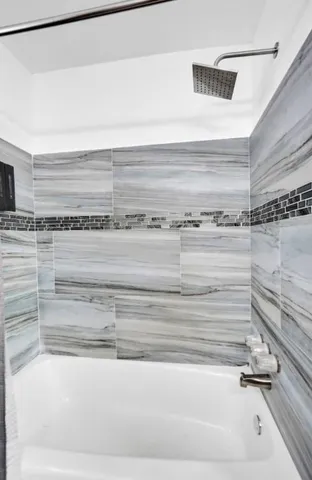 a bathroom with a toilet a sink and a bathtub