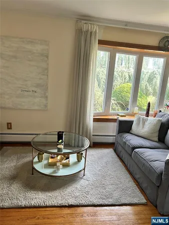 a living room with couch and a window