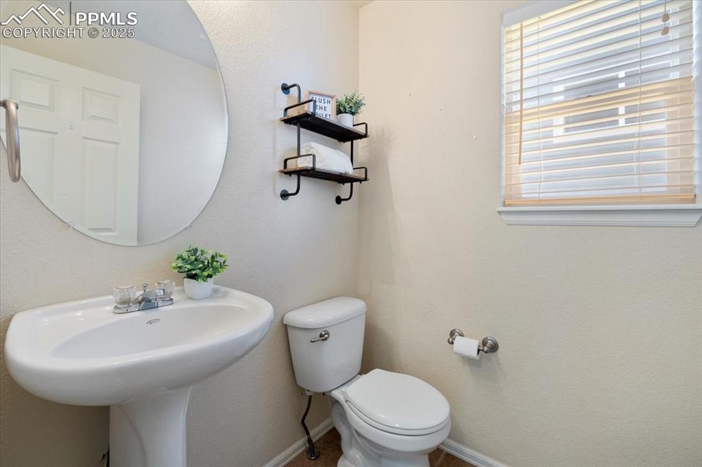 13038 Devil's Thumb Place Peyton, CO 80831 - Photo 12 of 44 Powder Bathroom with pedestal sink.