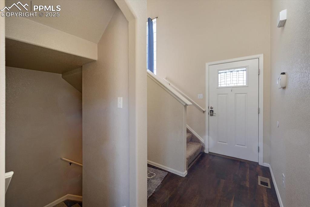 13038 Devil's Thumb Place Peyton, CO 80831 - Photo 2 of 44 Front Entry with stairs to the main level.