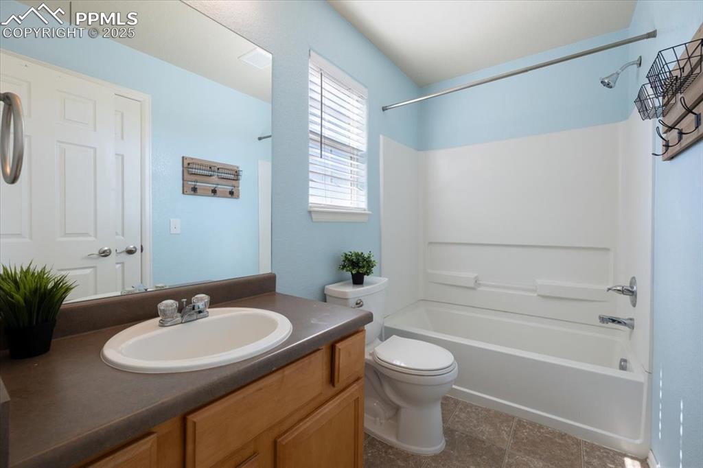 13038 Devil's Thumb Place Peyton, CO 80831 - Photo 21 of 44 Full Bathroom with vanity, mirror, and tub/shower.