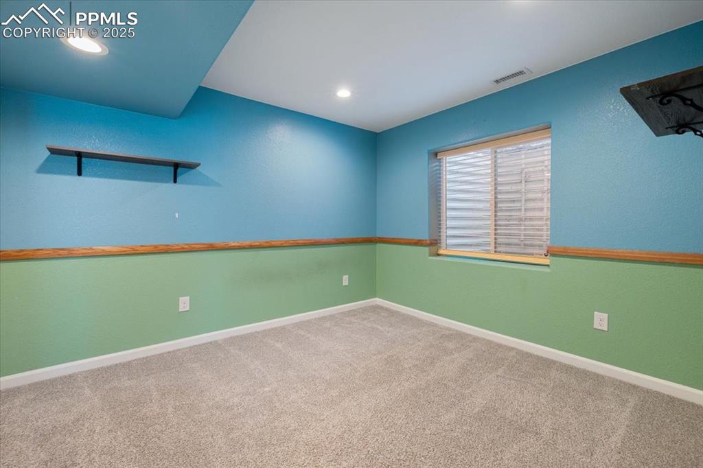 13038 Devil's Thumb Place Peyton, CO 80831 - Photo 32 of 44 Basement Bedroom #4 with neutral carpet.