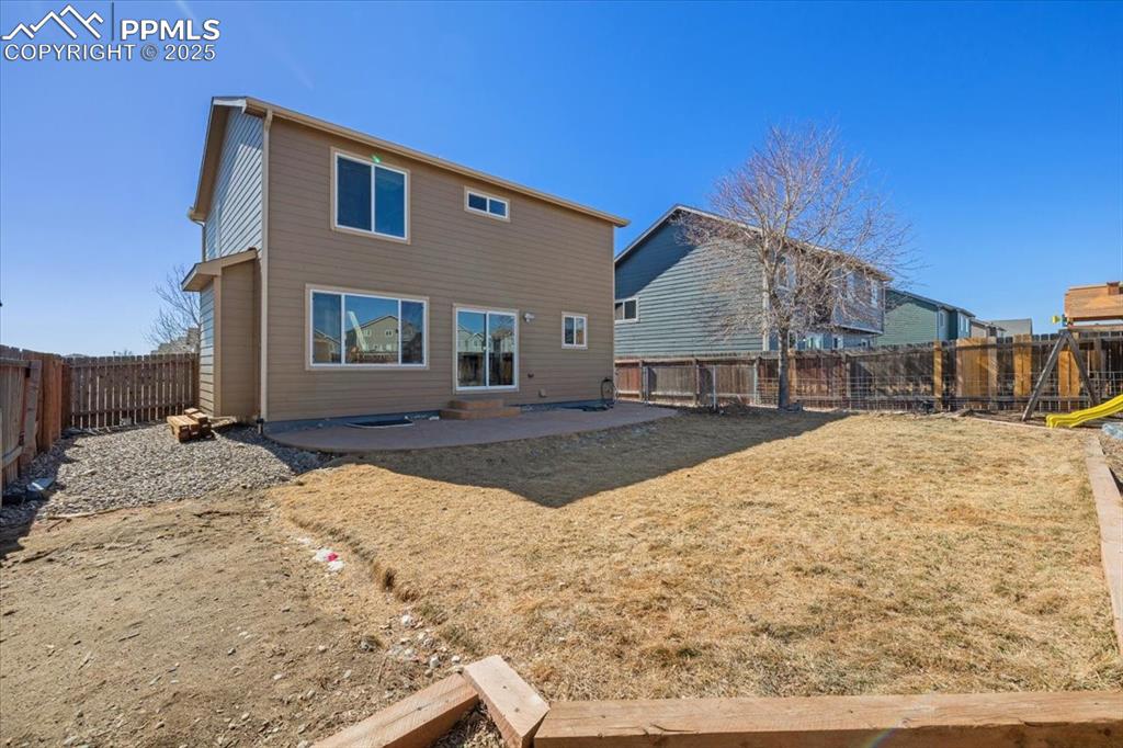 13038 Devil's Thumb Place Peyton, CO 80831 - Photo 37 of 44 Rear view of home and fenced backyard.