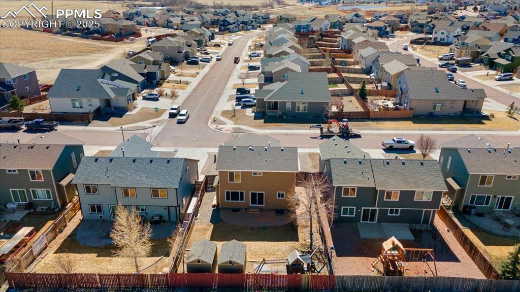 13038 Devil's Thumb Place Peyton, CO 80831 - Photo 41 of 44 Aerial rear view of home, backyard, and neighborhood.