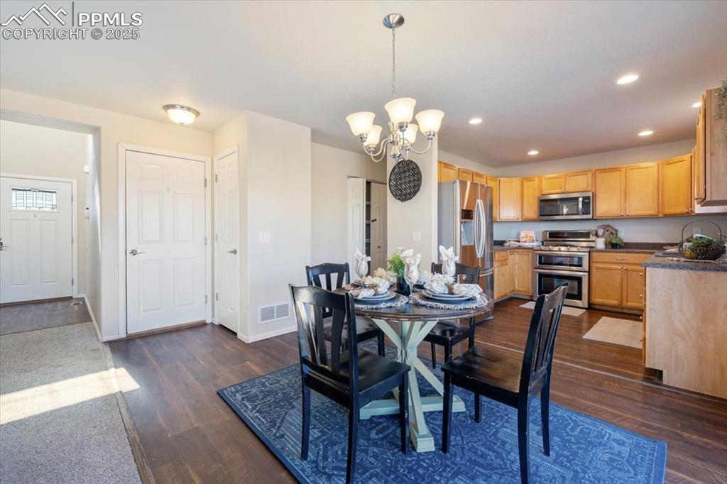 13038 Devil's Thumb Place Peyton, CO 80831 - Photo 6 of 44 The Dining Area is located just off the Kitchen for easy food service and clean up.