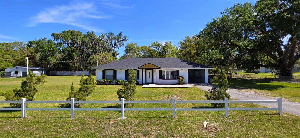 a view of a house with swimming pool
