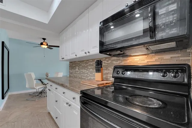 a kitchen with a stove and a microwave