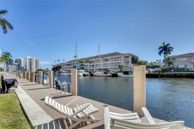 a view of a lake with a table and chairs