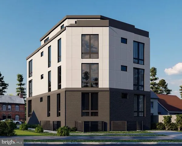 a large white building with a small yard