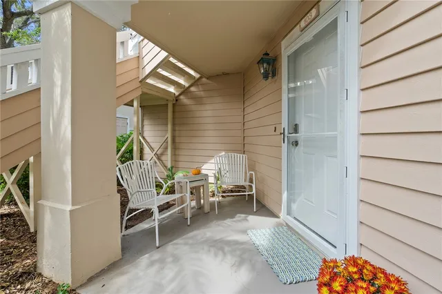 a backyard of a house with outdoor seating