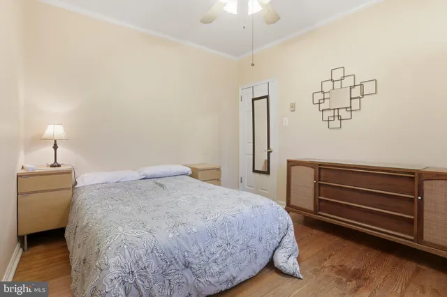 a bedroom with a bed and a dresser