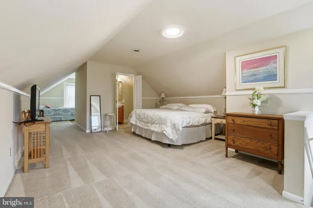 a balcony with wooden floors and furniture