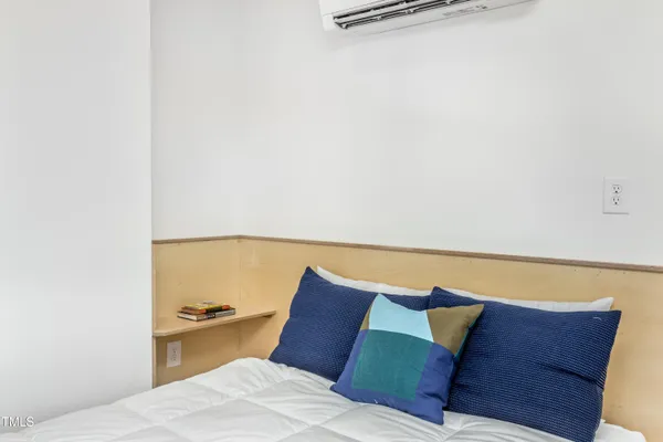 a bedroom with a bed and couch