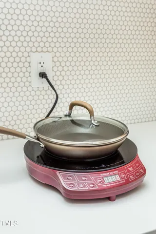 a bathroom with a sink and mirror