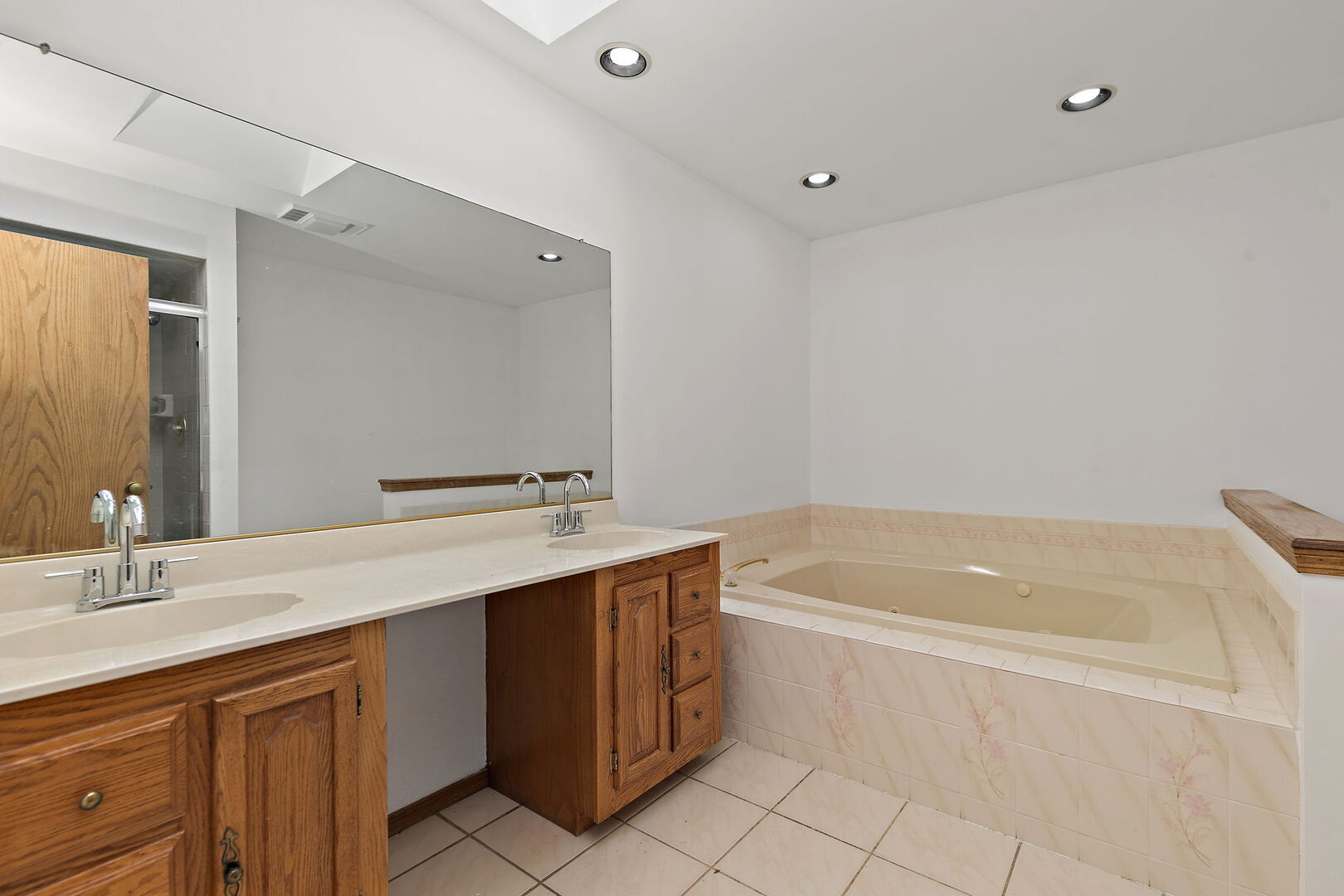 1874 Ranchview Drive Naperville, IL 60565 - Photo 11 of 21 a bathroom with a tub sink and mirror