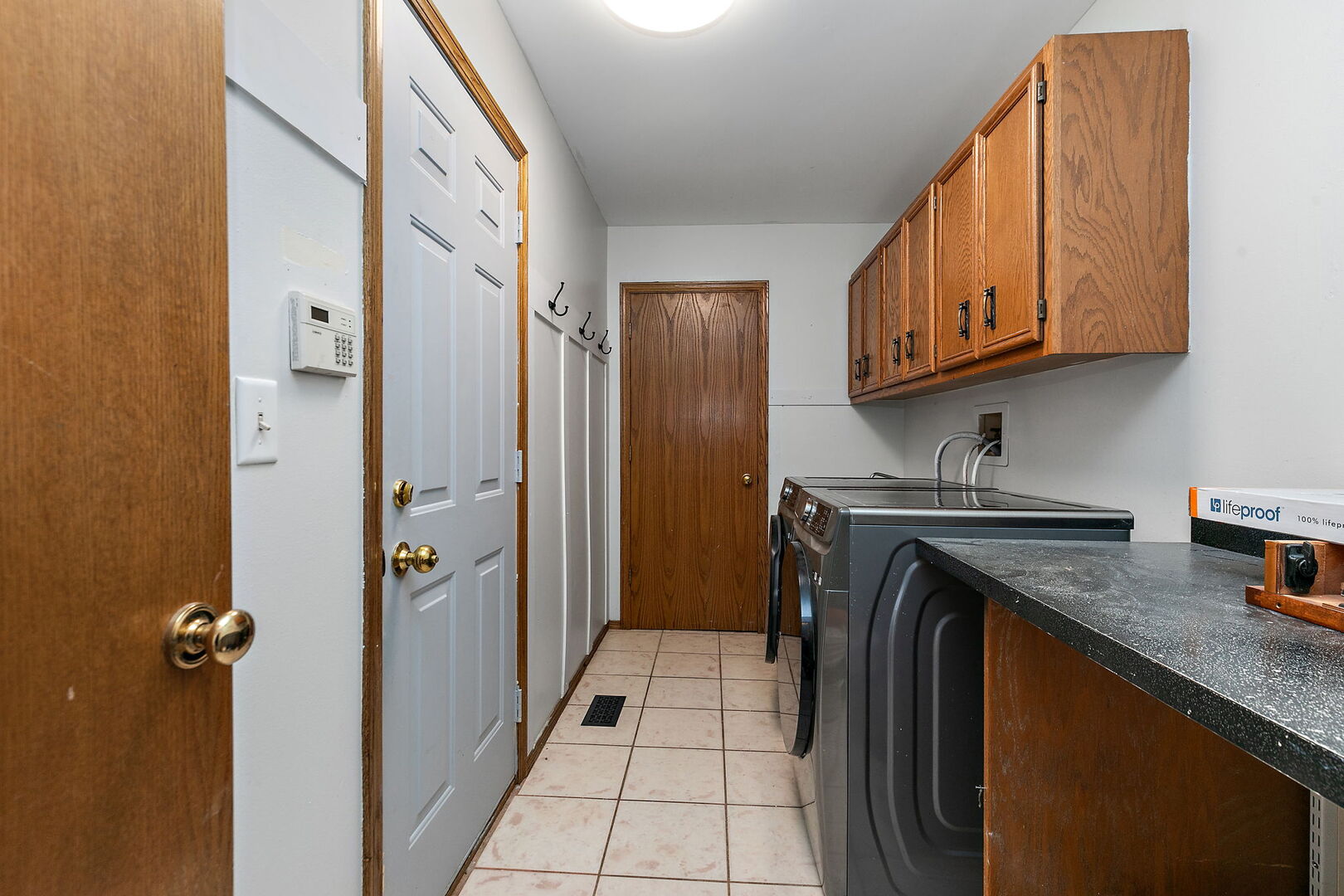 1874 Ranchview Drive Naperville, IL 60565 - Photo 19 of 21 a utility room with cabinets washer and dryer