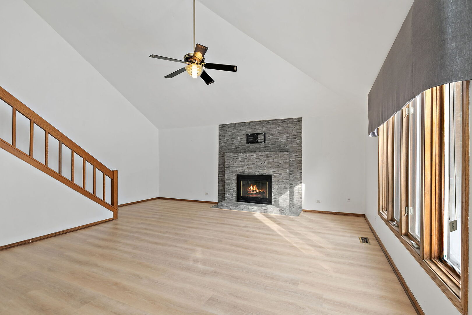 1874 Ranchview Drive Naperville, IL 60565 - Photo 7 of 21 a view of empty room with fireplace and fan