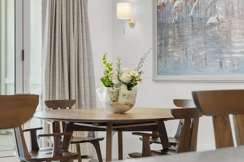 a bathroom with a granite countertop sink a mirror a and a shower