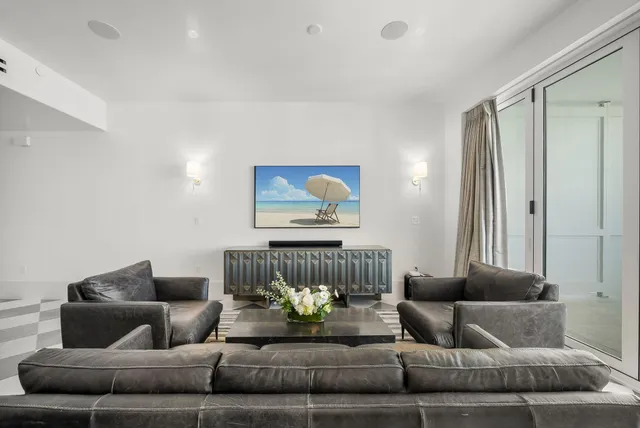 a bathroom with double vanity and a shower