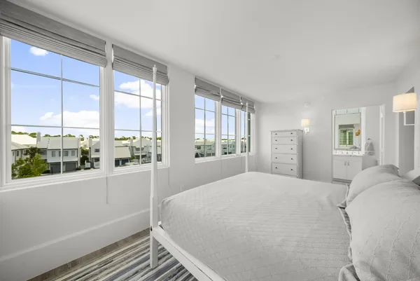 a living room with a couch and windows