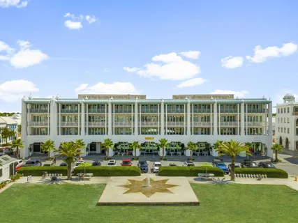 a front view of a house with swimming pool and porch