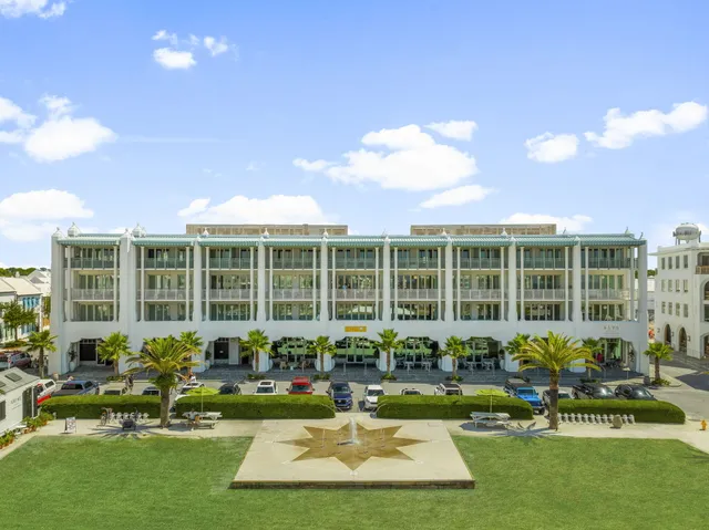 a front view of a house with swimming pool and porch