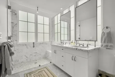 a bathroom with a bathtub and a shower