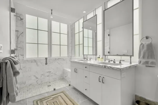 a bathroom with a bathtub and a shower