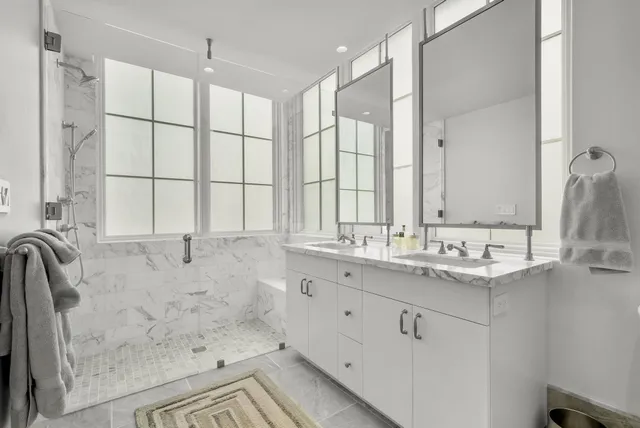 a bathroom with a bathtub and a shower