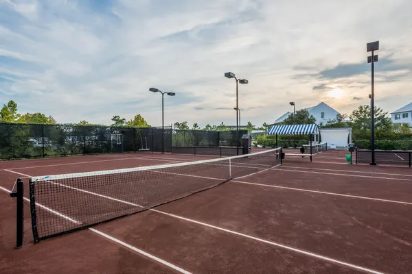 a view of a house with sitting area and garden