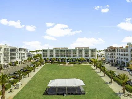 a front view of a building with potted plants