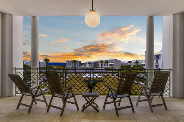a kitchen with stainless steel appliances a stove a table and chairs