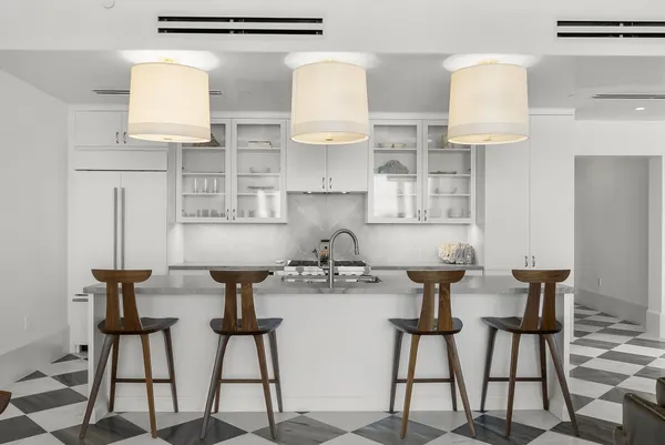a kitchen with stainless steel appliances granite countertop a sink and a stove
