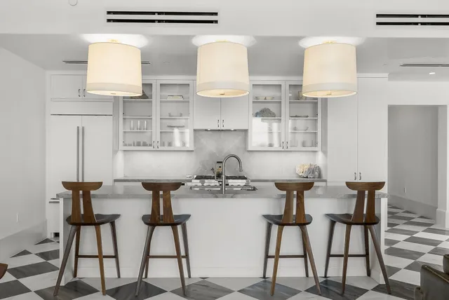 a kitchen with stainless steel appliances granite countertop a sink and a stove