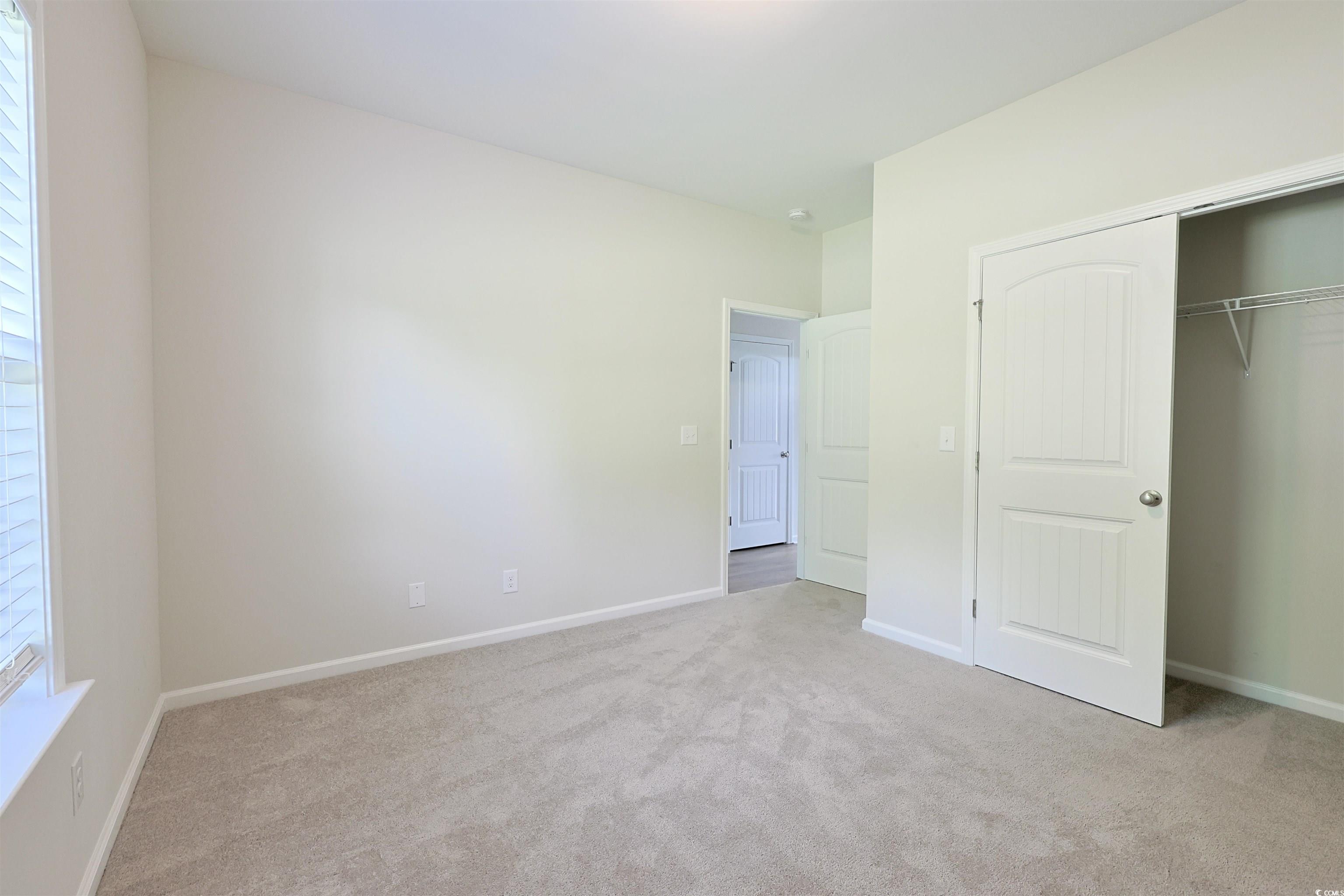 266 Ole Maple Street Loris, SC 29569 - Photo 18 of 30 Unfurnished bedroom with carpet flooring and a closet